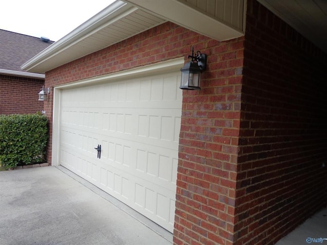  - garage featuring driveway
