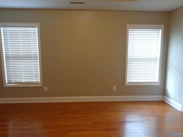  - unfurnished room featuring light wood-style floors and baseboards