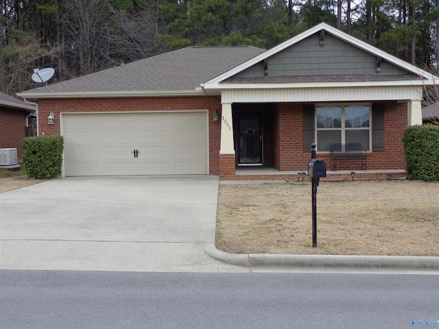  - single story home featuring brick siding, roof with shingles, concrete driveway, and an attached garage