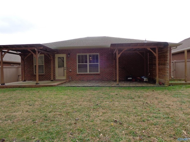  - view of front of home featuring a patio, brick siding, a front lawn, and a pergola