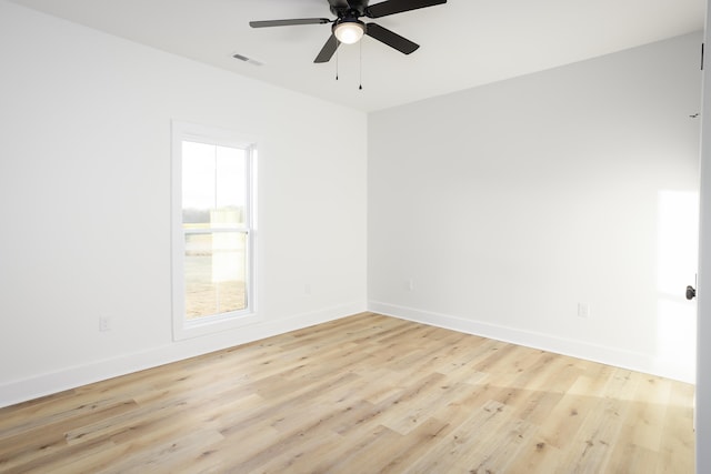 spare room featuring ceiling fan and light wood-type flooring