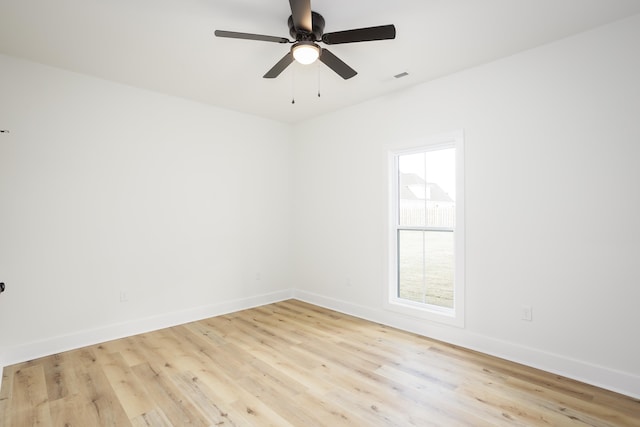 spare room featuring light hardwood / wood-style floors and ceiling fan