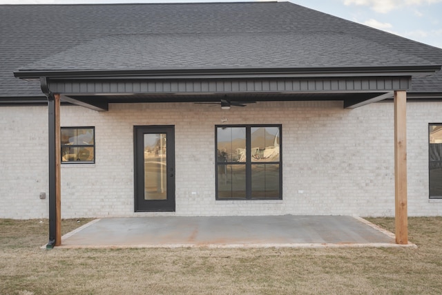 rear view of house featuring a lawn, a patio, and ceiling fan