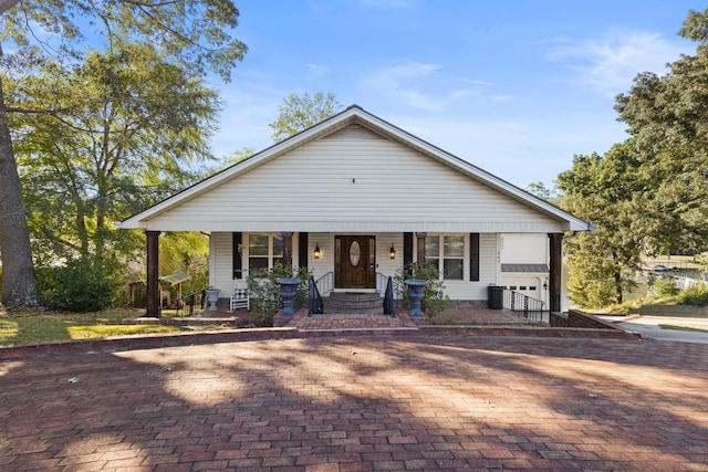 view of front of home featuring a garage and covered porch