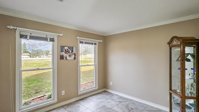 doorway featuring ornamental molding and baseboards