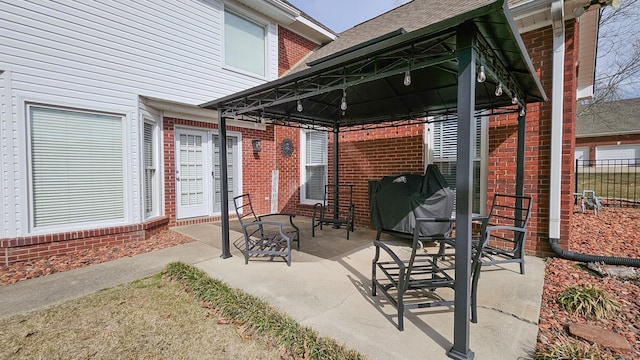 view of patio / terrace with a gazebo, fence, and area for grilling