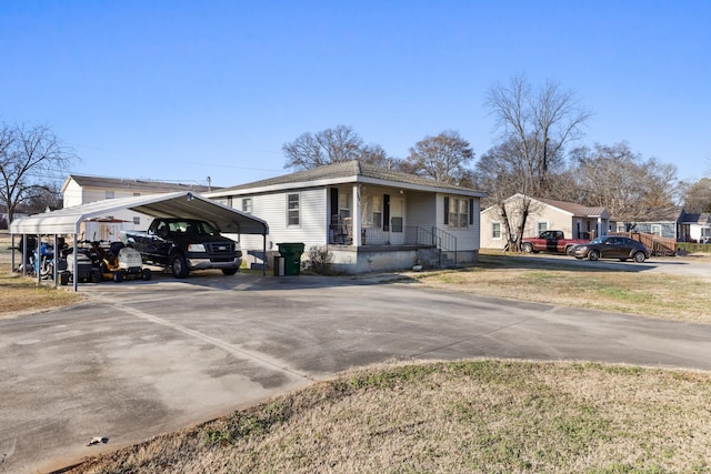 view of front of house featuring a carport and a porch