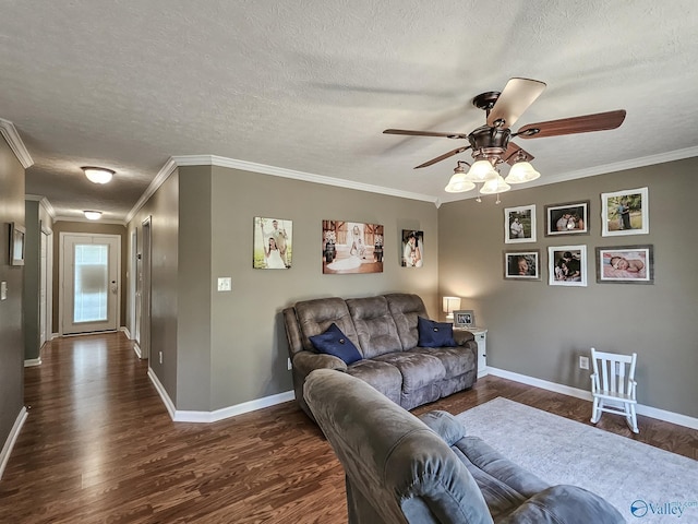 living room featuring a textured ceiling, dark hardwood / wood-style flooring, ceiling fan, and crown molding