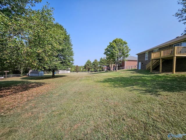 view of yard featuring a wooden deck