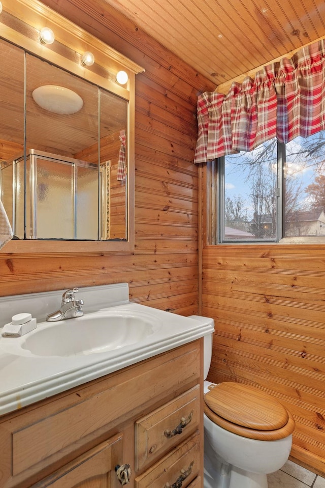 bathroom featuring wood walls, vanity, wood ceiling, toilet, and a shower with door