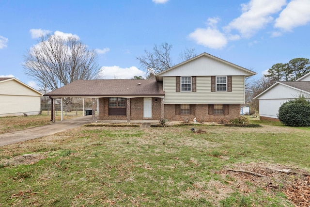 split level home featuring a front yard and a carport