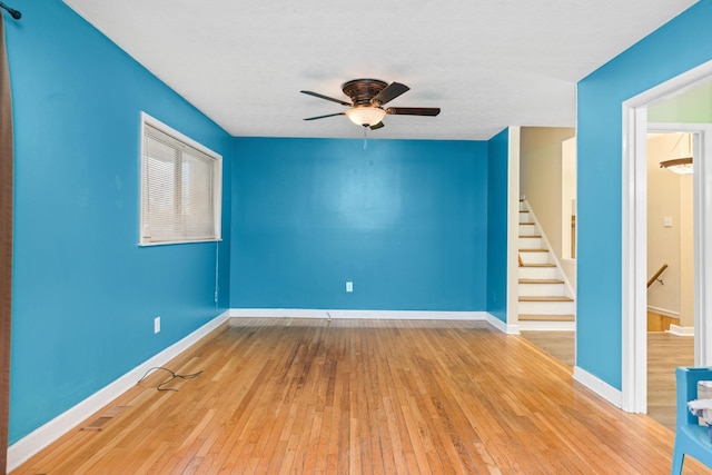 unfurnished room featuring light hardwood / wood-style flooring and ceiling fan