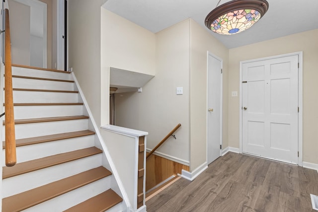 foyer entrance featuring hardwood / wood-style floors