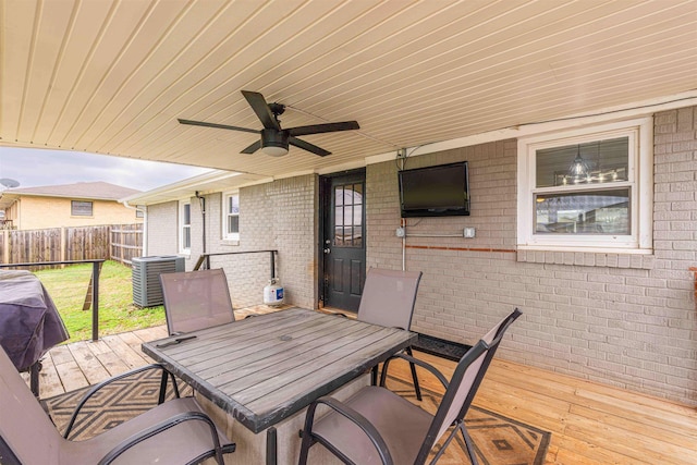 view of patio featuring ceiling fan, central AC unit, and a deck