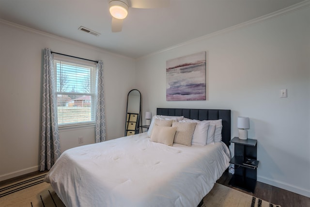 bedroom featuring ornamental molding, ceiling fan, dark hardwood / wood-style flooring, and a baseboard radiator