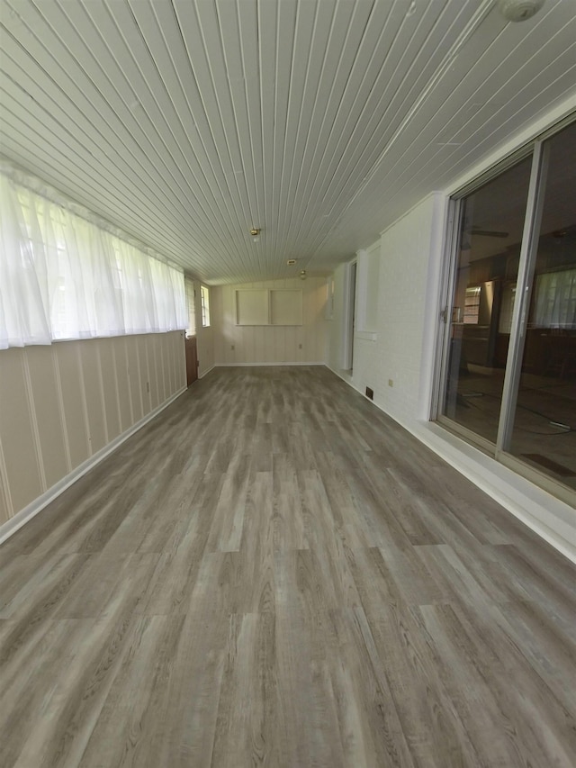  - spare room with wood finished floors and wood ceiling
