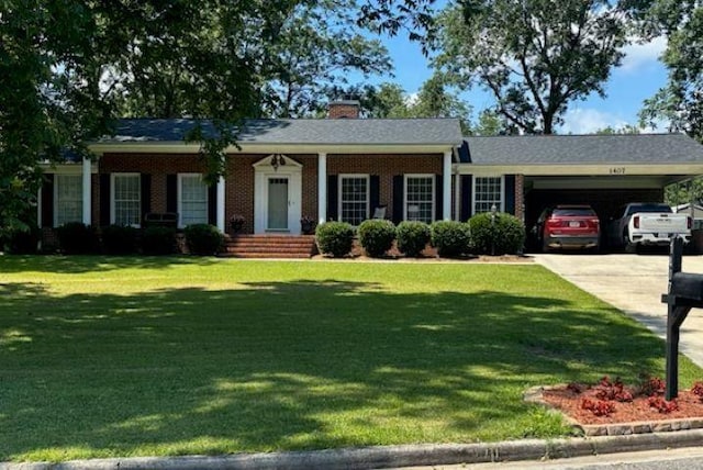  - ranch-style house featuring a front lawn, driveway, a chimney, and brick siding