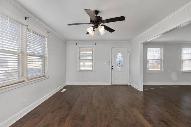 entryway with crown molding, dark wood-type flooring, and ceiling fan