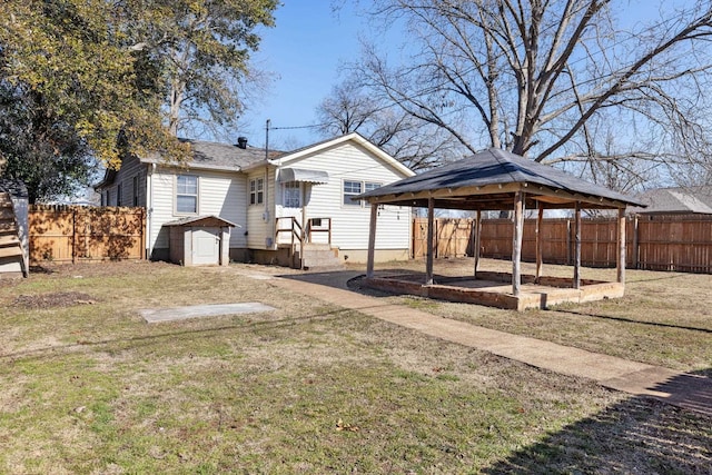 view of yard featuring a gazebo and a shed