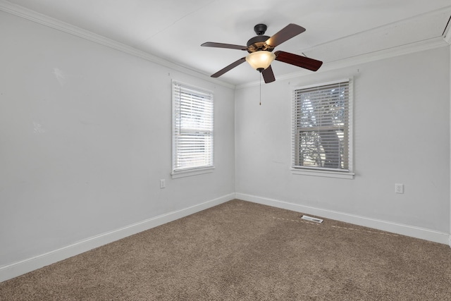 carpeted empty room with crown molding and ceiling fan