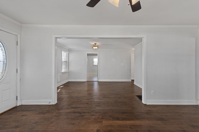 foyer entrance with dark hardwood / wood-style flooring, crown molding, and ceiling fan