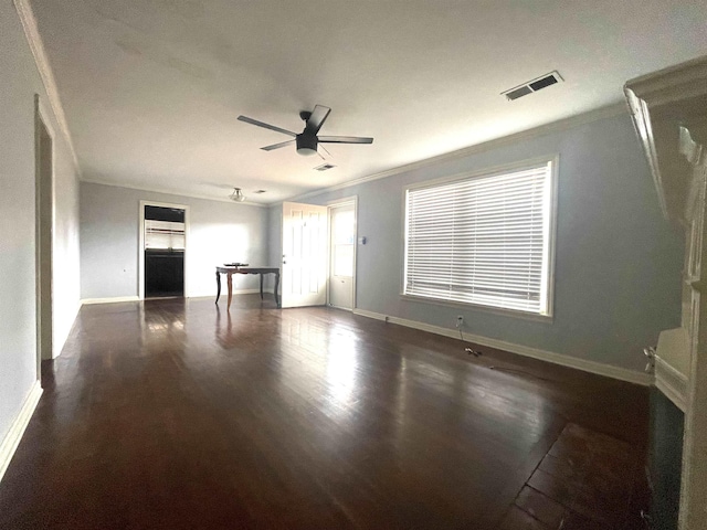 interior space featuring ceiling fan, dark hardwood / wood-style floors, and ornamental molding