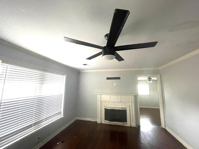 unfurnished living room with dark wood-type flooring and ornamental molding