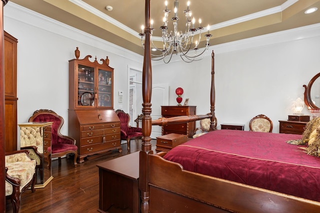 bedroom with dark hardwood / wood-style flooring, a raised ceiling, crown molding, and a chandelier