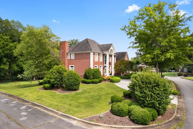 view of property exterior with a yard