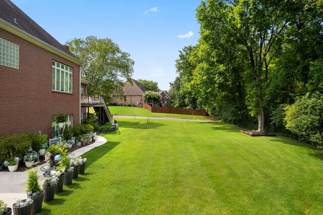 view of yard featuring a wooden deck