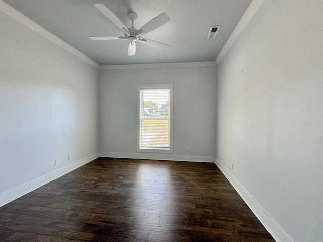 spare room with ceiling fan, dark hardwood / wood-style flooring, and ornamental molding