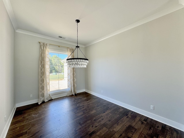 unfurnished dining area with dark hardwood / wood-style flooring, an inviting chandelier, and ornamental molding