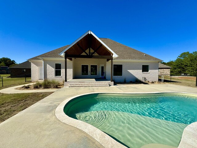 view of swimming pool with a patio