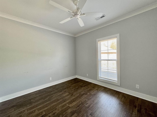 spare room featuring ceiling fan, crown molding, and dark hardwood / wood-style floors