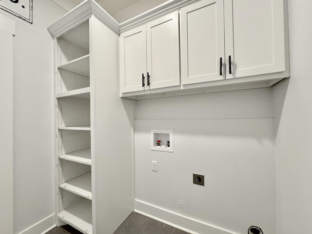 laundry room featuring cabinets, hookup for a washing machine, and electric dryer hookup