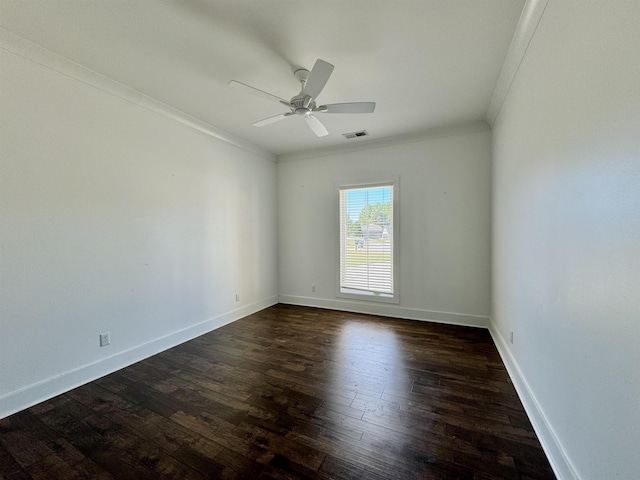 spare room with dark hardwood / wood-style flooring, ceiling fan, and ornamental molding