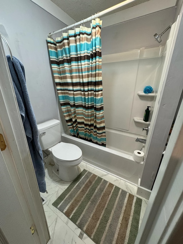 bathroom featuring toilet and shower / tub combo