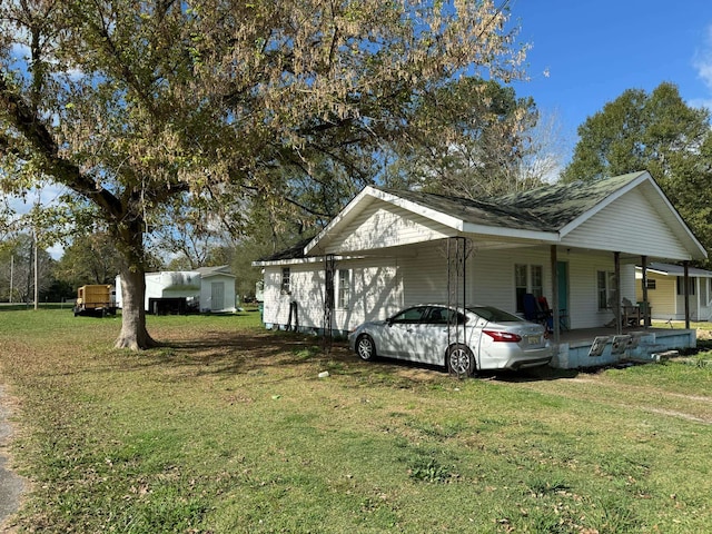 view of property exterior with a carport and a yard