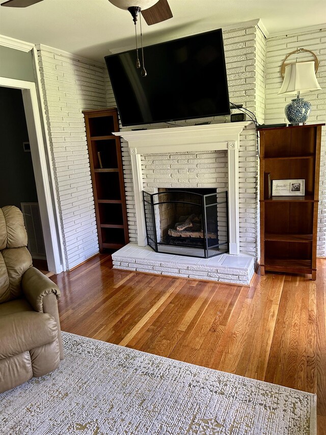 dining area featuring healthy amount of natural light, crown molding, baseboards, wood finished floors, and a chandelier