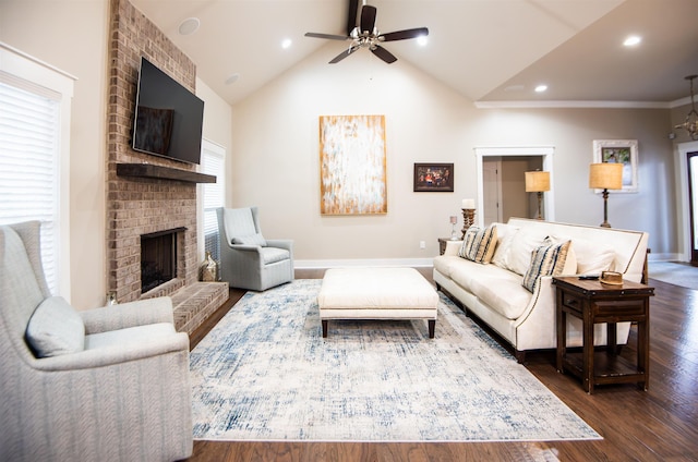 living room with dark hardwood / wood-style flooring, a brick fireplace, high vaulted ceiling, and ceiling fan