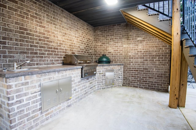 view of patio with a grill, exterior kitchen, and sink