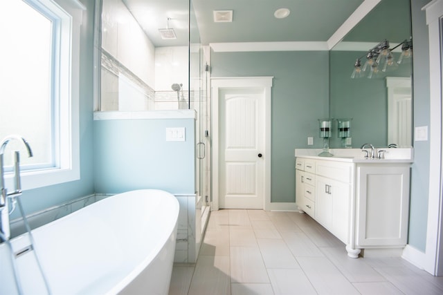 bathroom with vanity, ornamental molding, and independent shower and bath