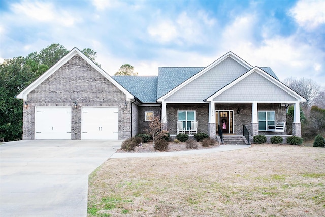 craftsman-style house with a garage, covered porch, and a front lawn