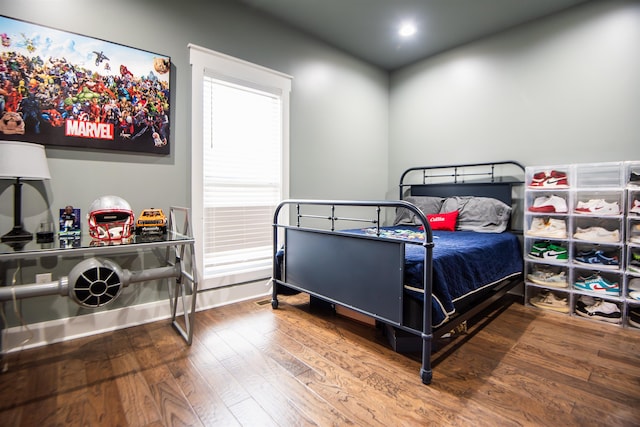 bedroom with hardwood / wood-style floors