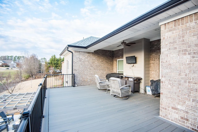 wooden deck with ceiling fan