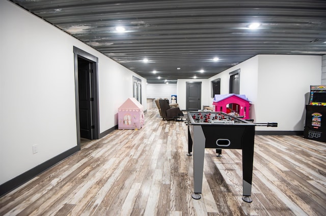 recreation room featuring light hardwood / wood-style flooring