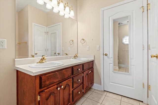bathroom featuring tile patterned floors and double vanity