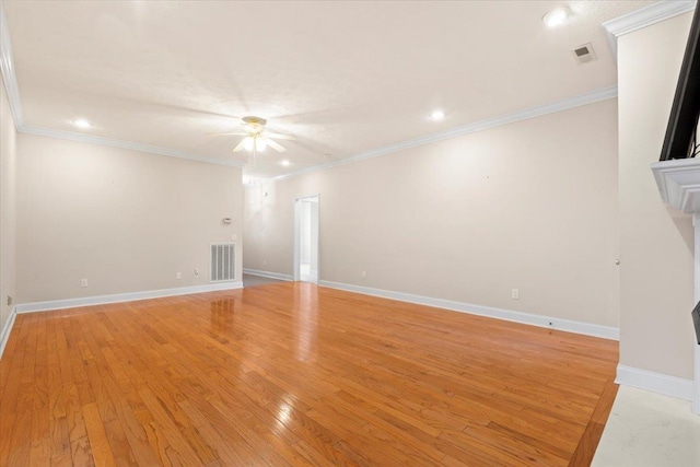 unfurnished room featuring ceiling fan, light wood finished floors, crown molding, recessed lighting, and baseboards