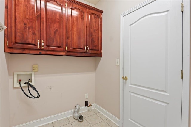 laundry area featuring cabinet space, hookup for a washing machine, tile patterned flooring, and baseboards