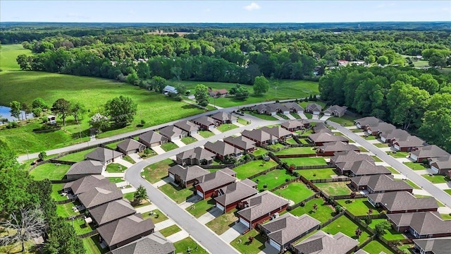 aerial perspective of suburban area with a forest